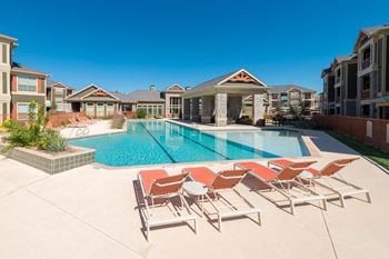 Expansive resort style pool and custom fountain, lounge deck, and cabanas